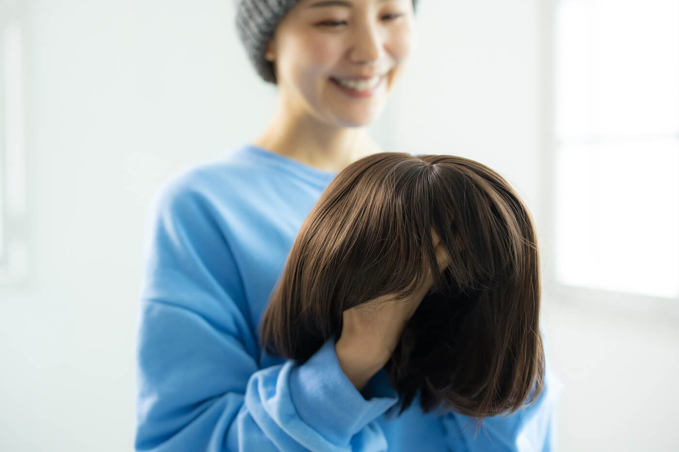 ウィッグ・帽子・穏やかな表情の患者イメージ